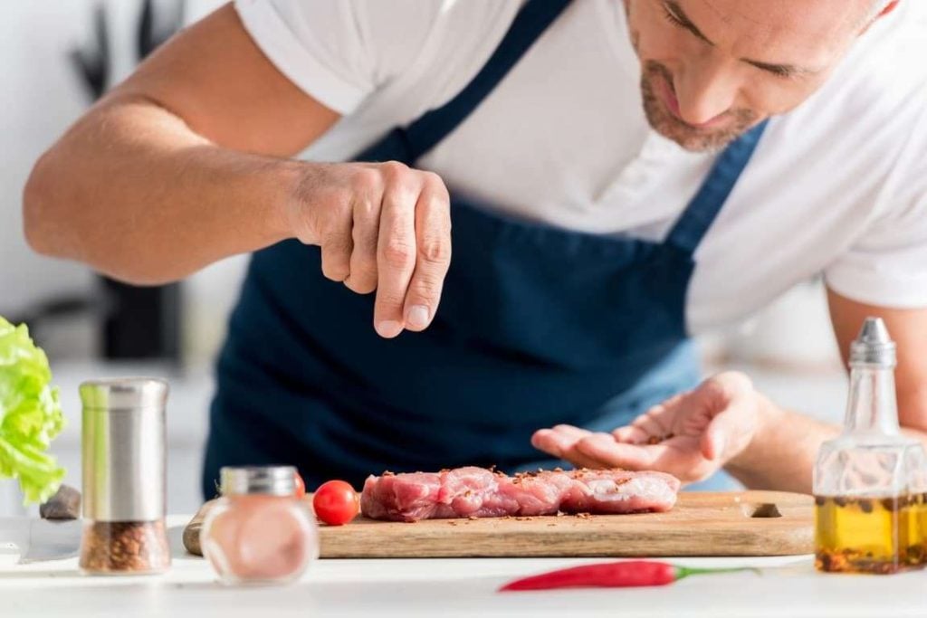 When and How to Salt Steak 1 Image of Chef salting a steak