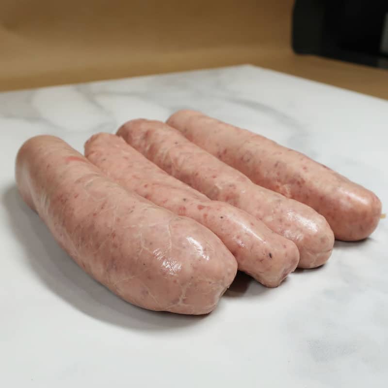 Free Range Irish Pork Sausages 3 Line up of raw pork sausages