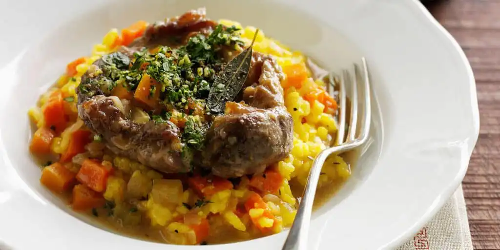 How to Cook Osso Bucco: A Butcher's Guide 2 Osso bucco served with risotto.