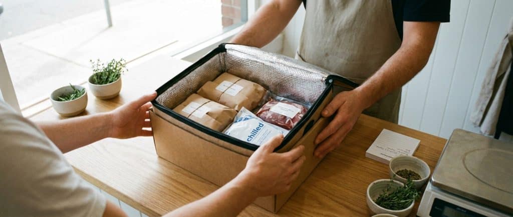 Handing over a meat delivery box