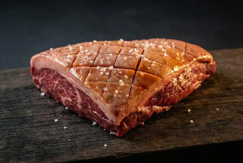 The Complete Guide to Australian Beef Cuts: How the Carcass Breaks Down 4 Raw picanha steak on wooden board